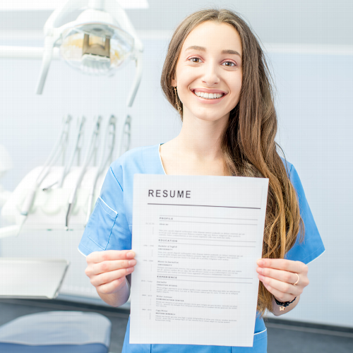 Dental Nurse holding up resume